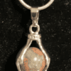 Hands Holding Earth Stone Necklace Jade2